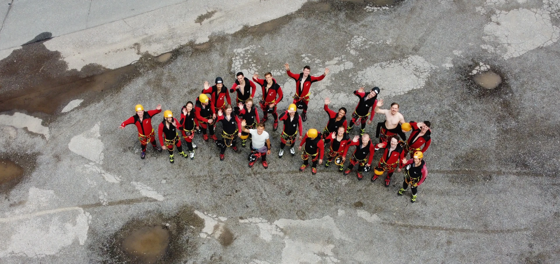 Aerial view of the team forming a word on a rock face in the Allgäu